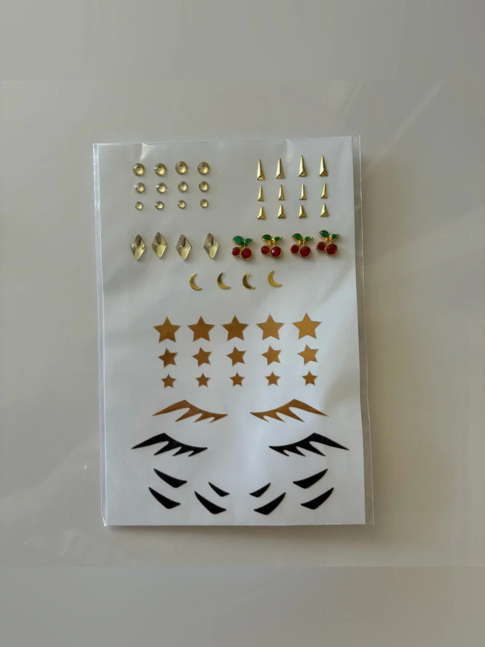 Urban Outfitters Pley Gold Celestial Face Sticker Set